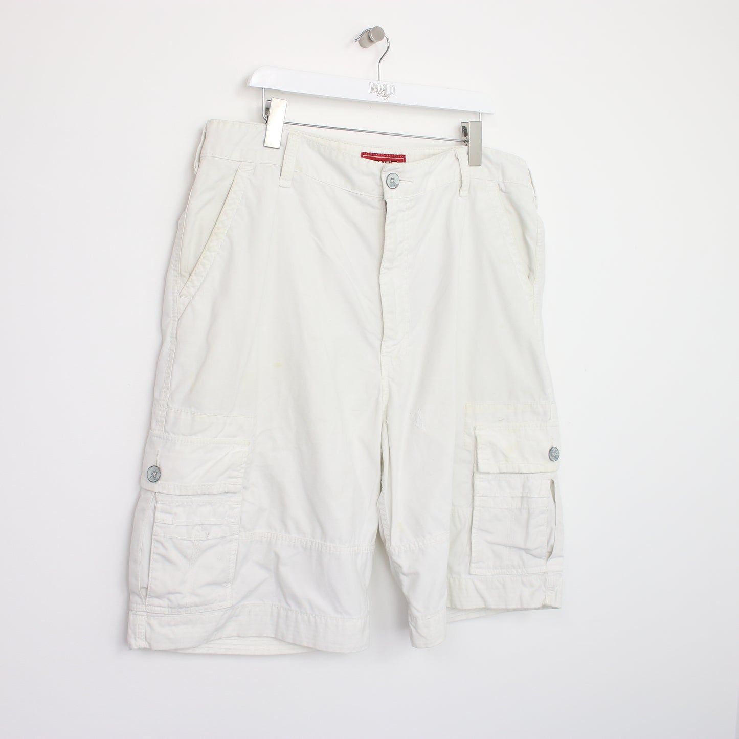 Vintage Levi's Cargo shorts in white. Best fits W40