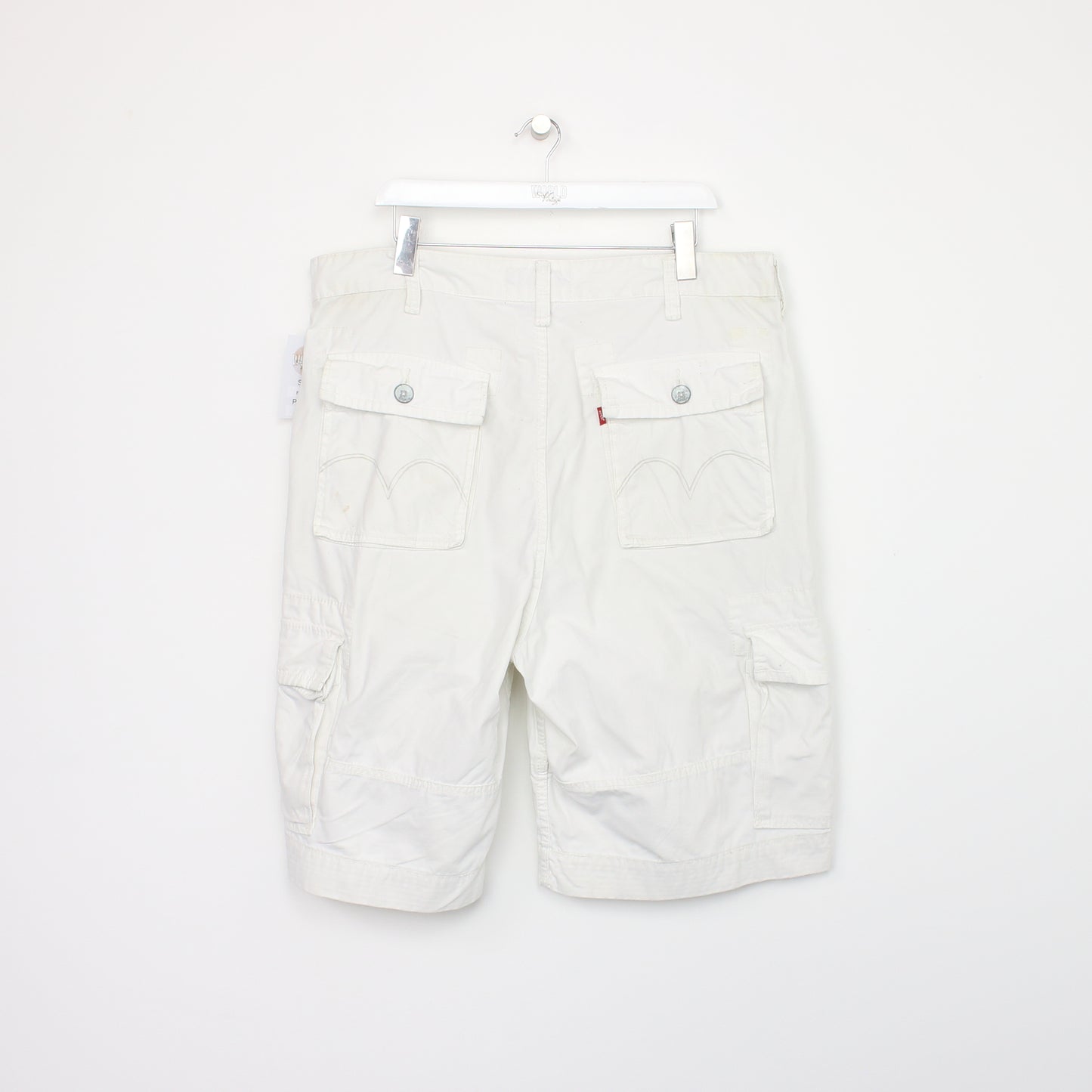 Vintage Levi's Cargo shorts in white. Best fits W40