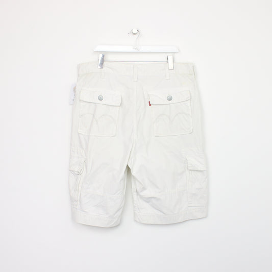 Vintage Levi's Cargo shorts in white. Best fits W40