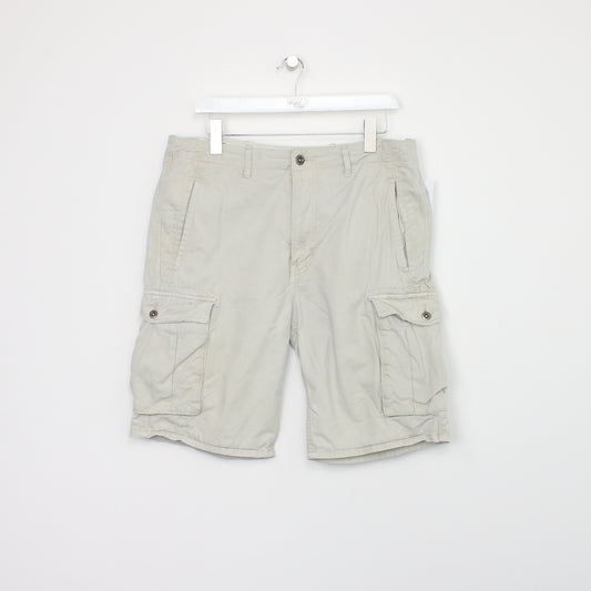 Vintage Levi's Cargo shorts in beige. Best fits W34