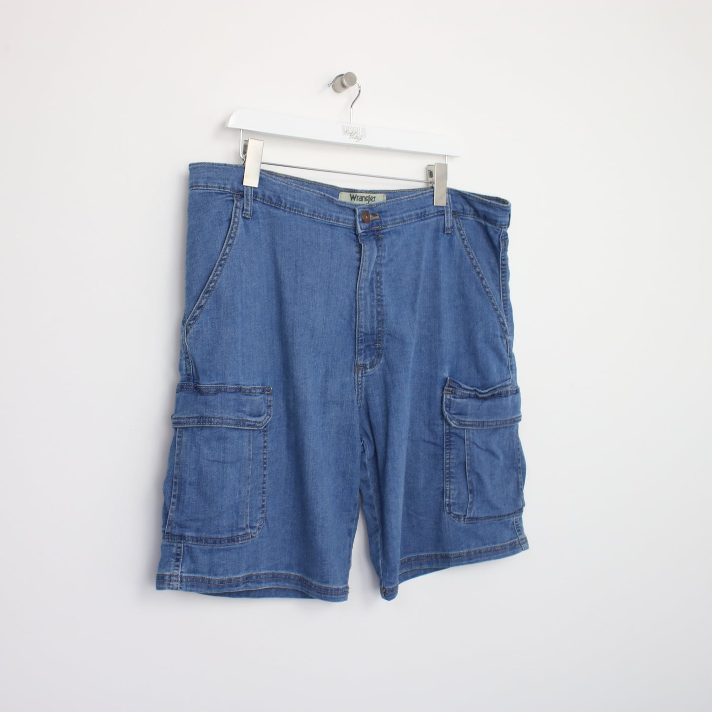 Vintage Wrangler denim cargo shorts in blue. Best fits W38