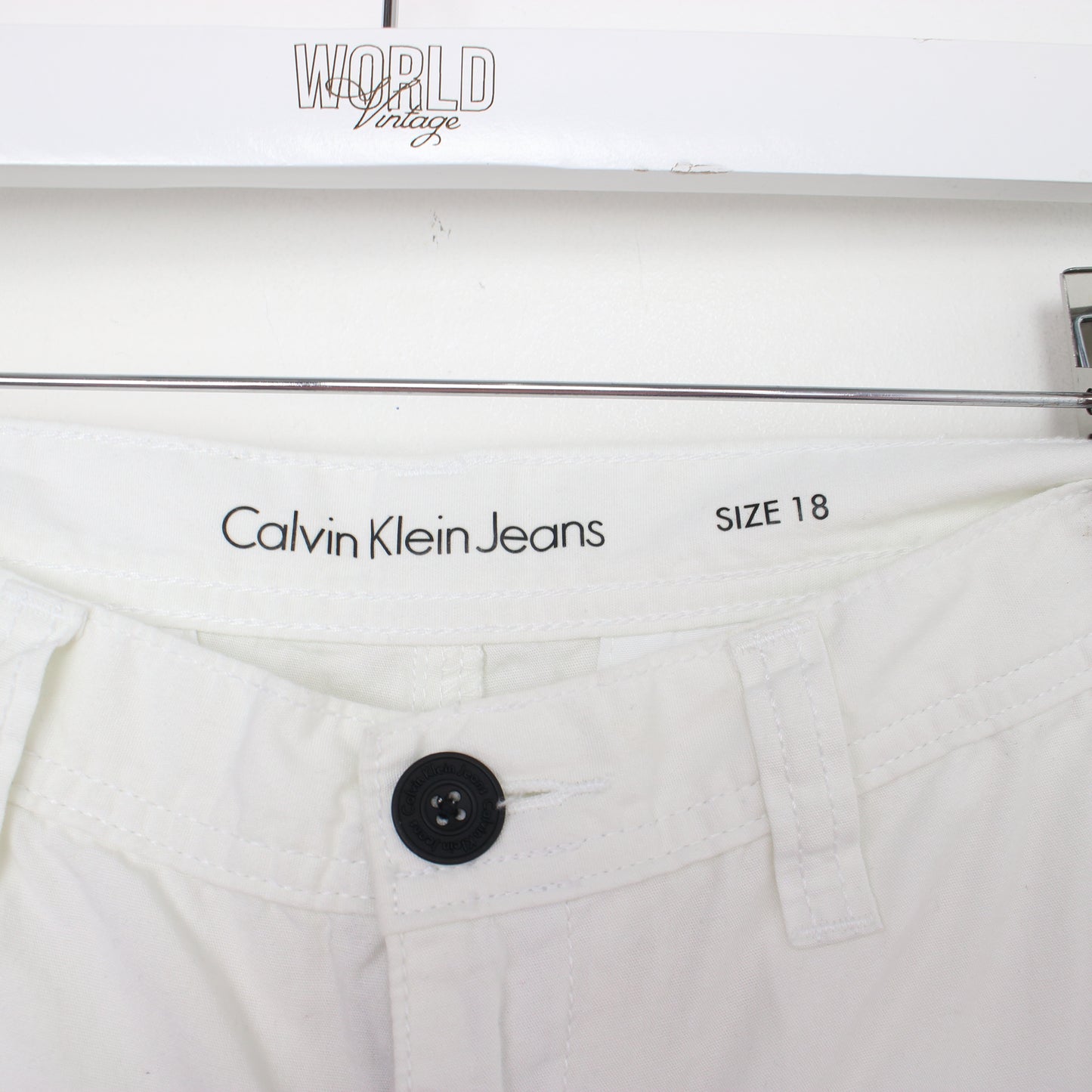 Vintage Calvin Klein cargo shorts in white. Best fits W28