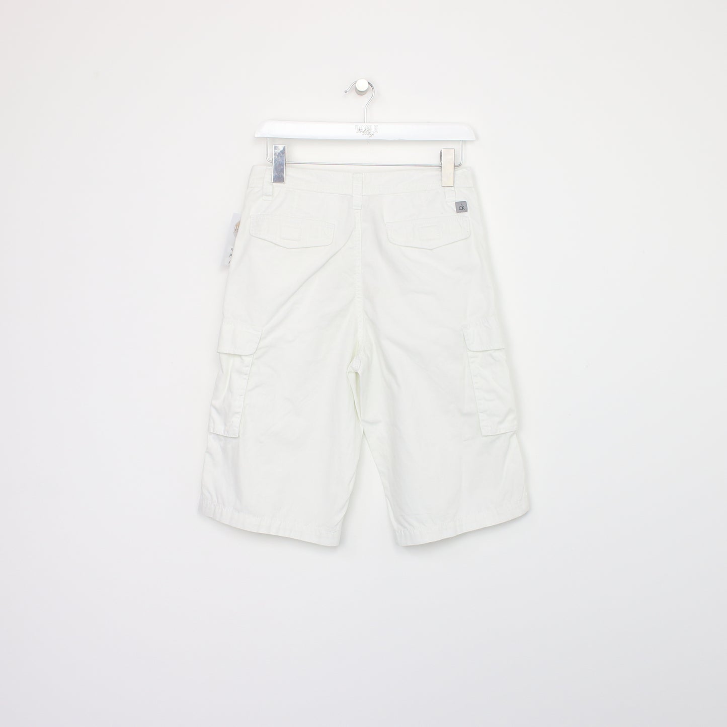 Vintage Calvin Klein cargo shorts in white. Best fits W28