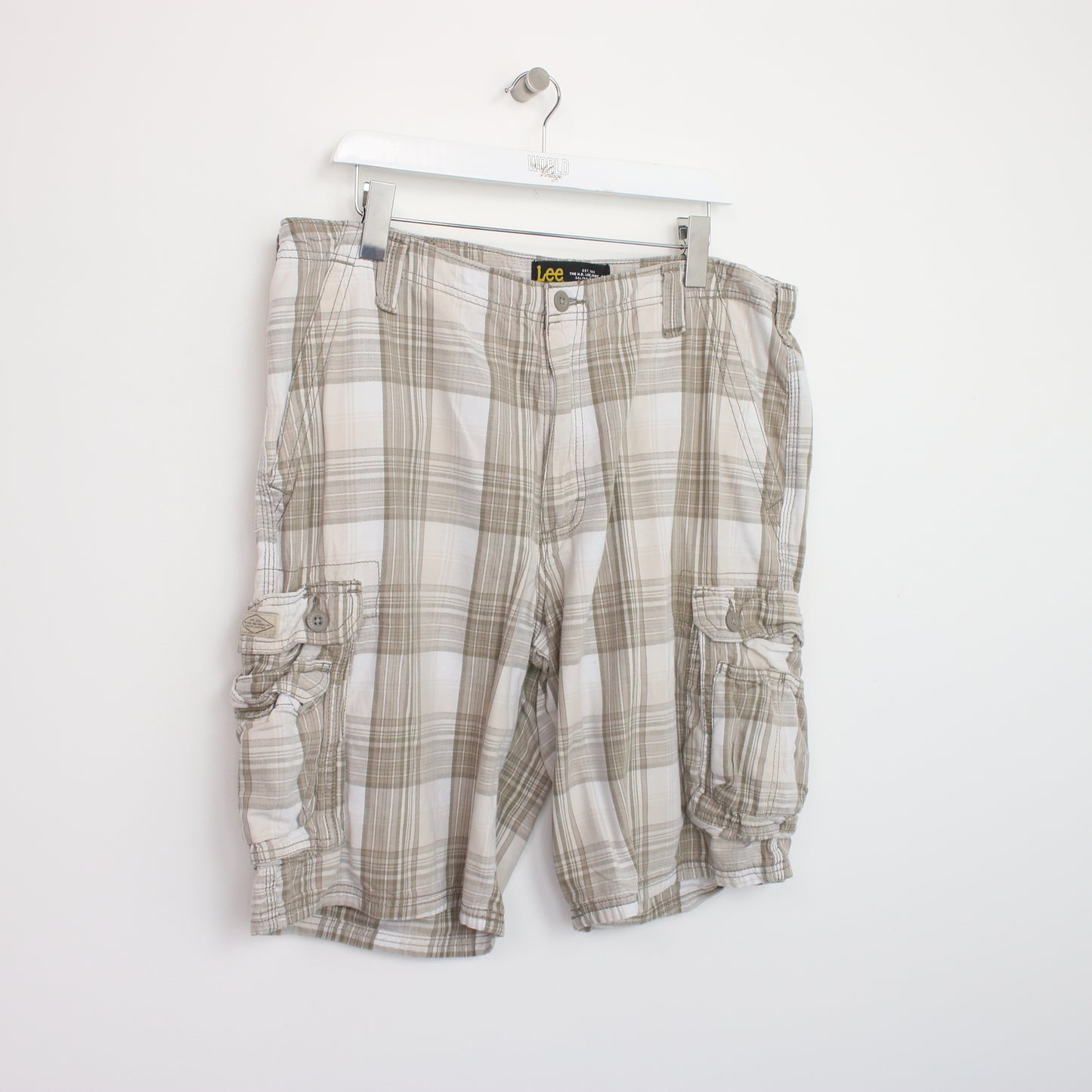 Vintage Lee Cargo shorts in beige tartan. Best fits W38