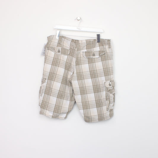 Vintage Lee Cargo shorts in beige tartan. Best fits W38