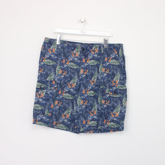 Vintage Izod Cargo shorts in blue. Best fits W38