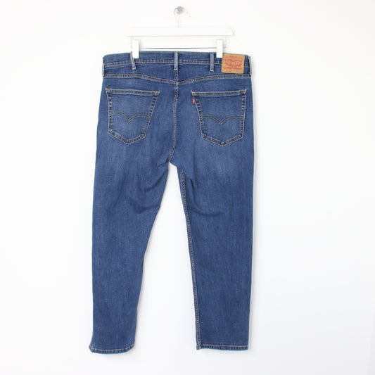 Vintage Levi jeans in blue. Best fits W38