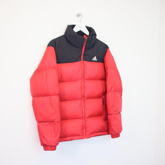 Vintage Adidas puffer jacket in red and black. Best fits M