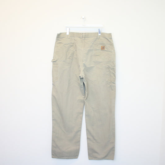 Vintage Carhartt carpenter jeans/trousers in beige. Best fits W42 L36