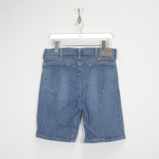 Vintage Wrangler denim cargo shorts in blue. Best fits W34