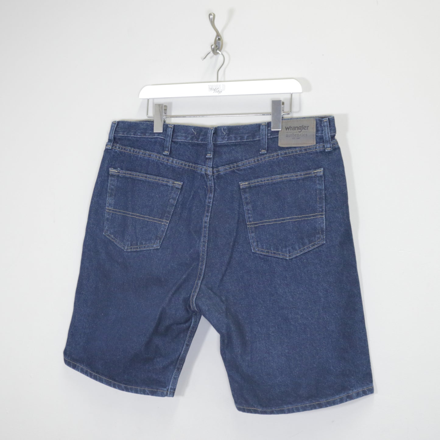 Vintage Wrangler denim cargo shorts in blue. Best fits W38