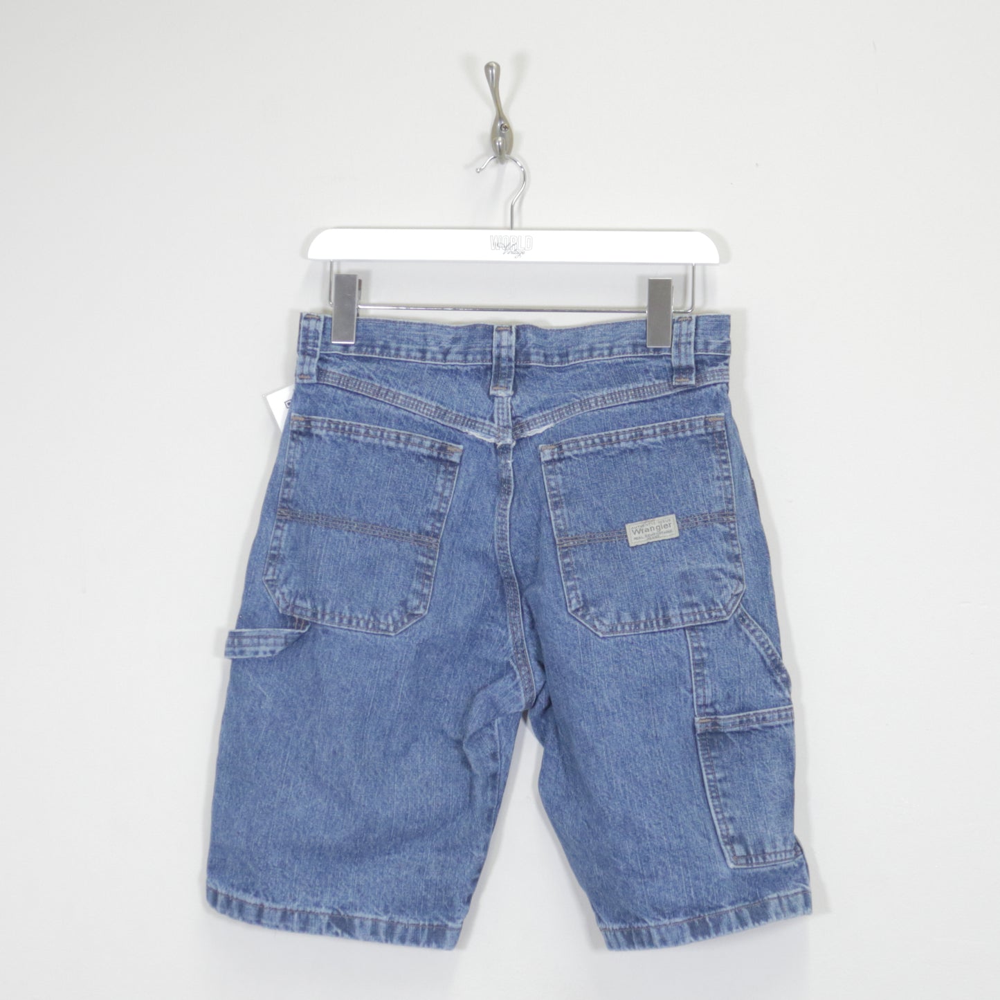 Vintage Wrangler denim cargo shorts in blue. Best fits W38