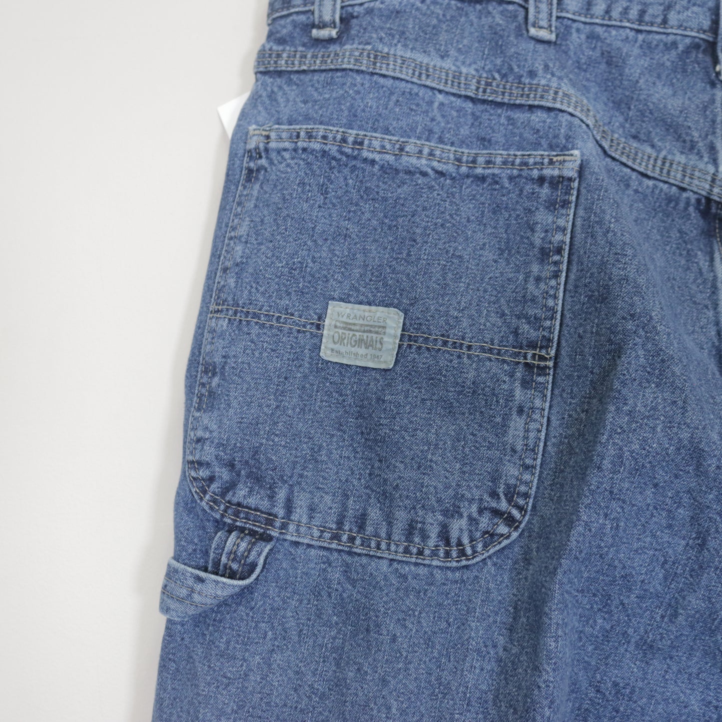 Vintage Wrangler denim cargo shorts in blue. Best fits W30