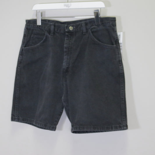 Vintage Wrangler denim shorts in black. Best fits W36