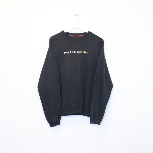 Vintage Nike spellout sweatshirt in black. Best fits M