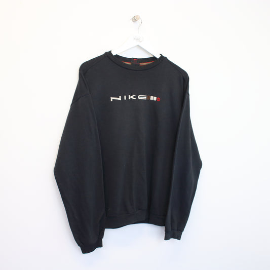 Vintage Nike spellout sweatshirt in black. Best fits M