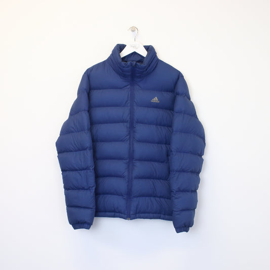 Vintage Adidas puffer jacket  in blue. Best fits L