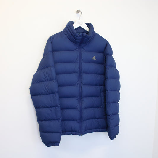 Vintage Adidas puffer jacket  in blue. Best fits L