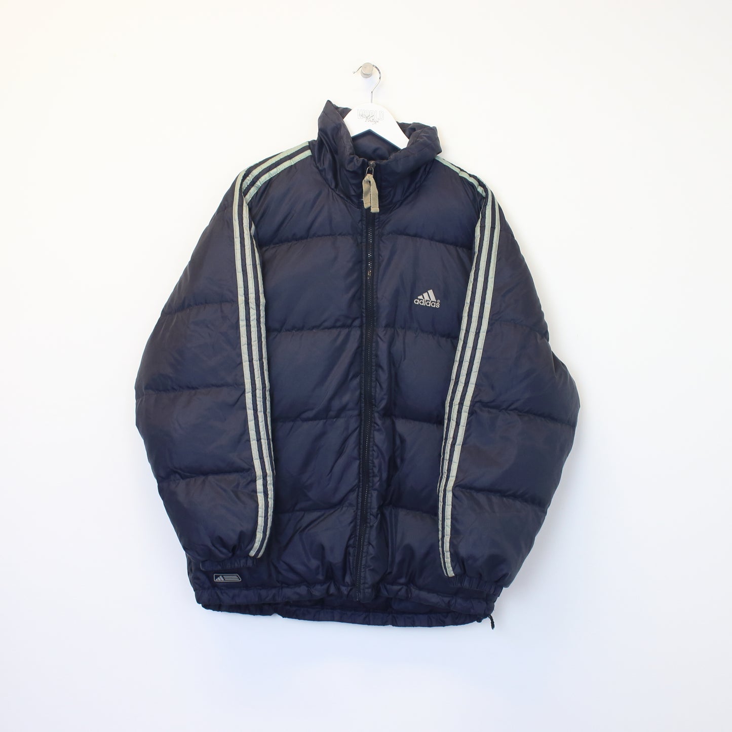 Vintage Adidas puffer jacket in navy. Best fits L