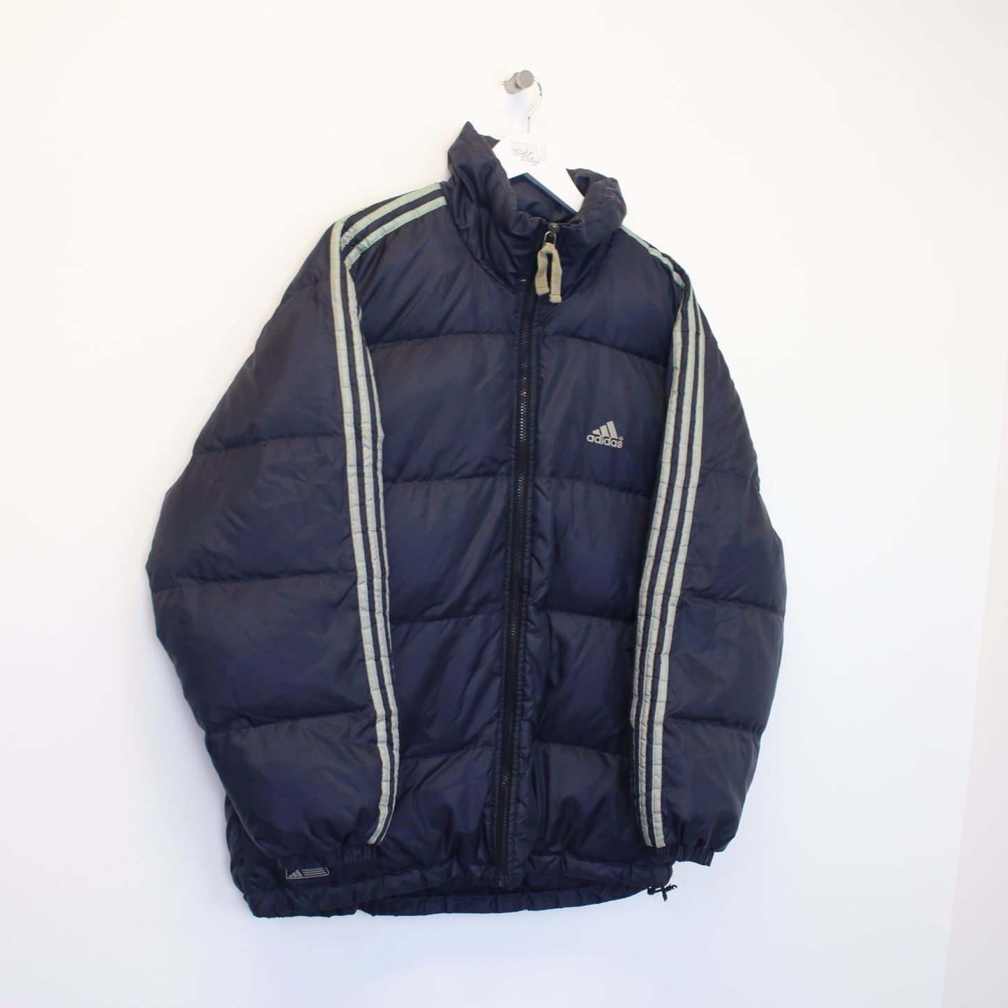 Vintage Adidas puffer jacket in navy. Best fits L