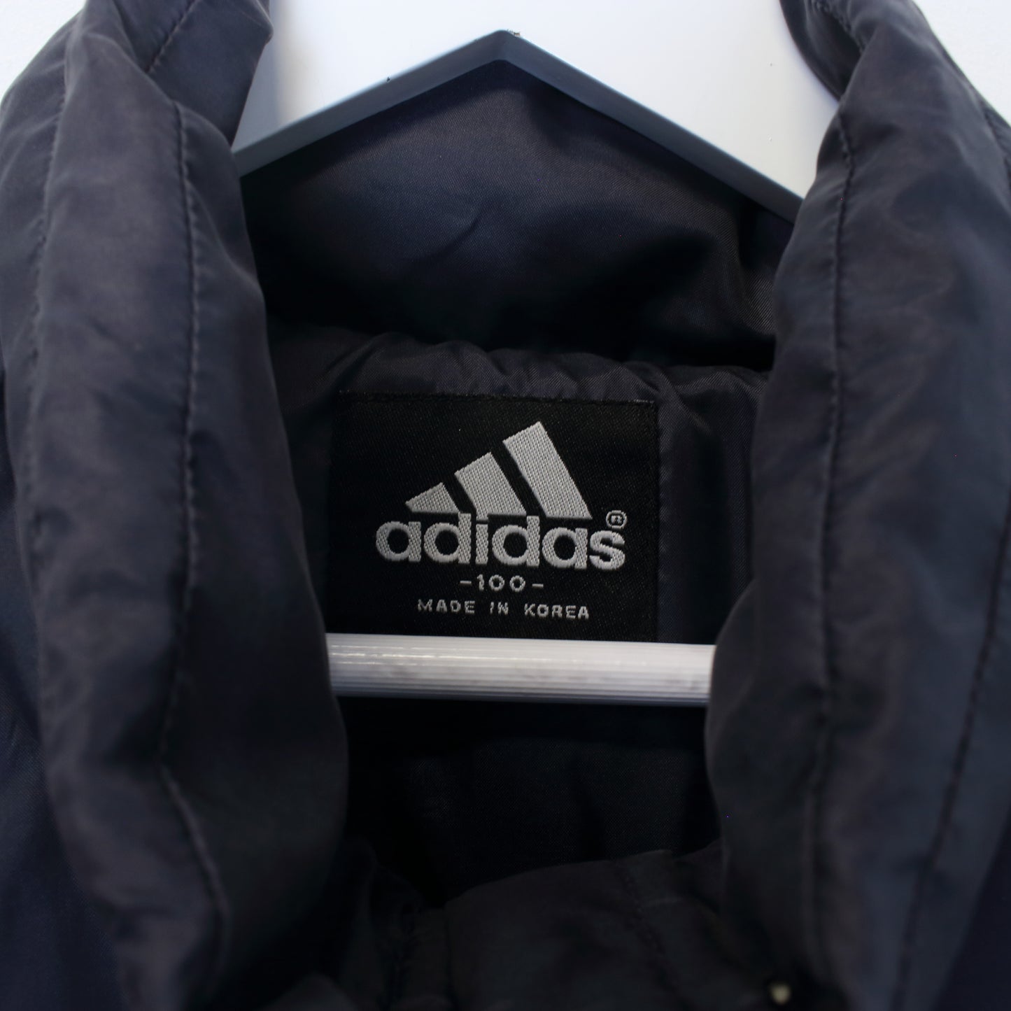 Vintage Adidas puffer jacket in navy. Best fits L