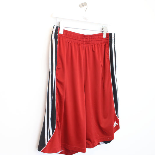 Vintage Adidas shorts in red and black. Best fits L