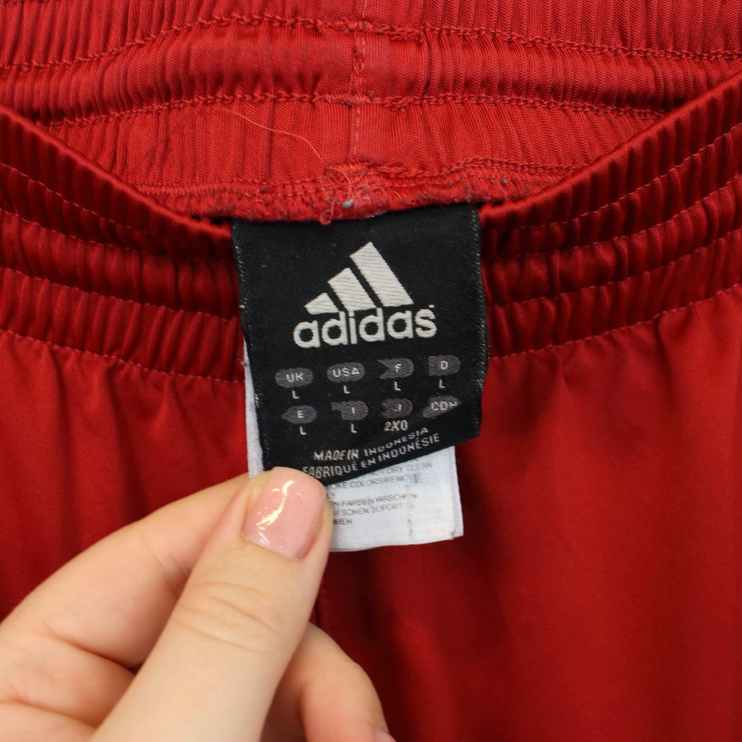 Vintage Adidas shorts in red and black. Best fits L