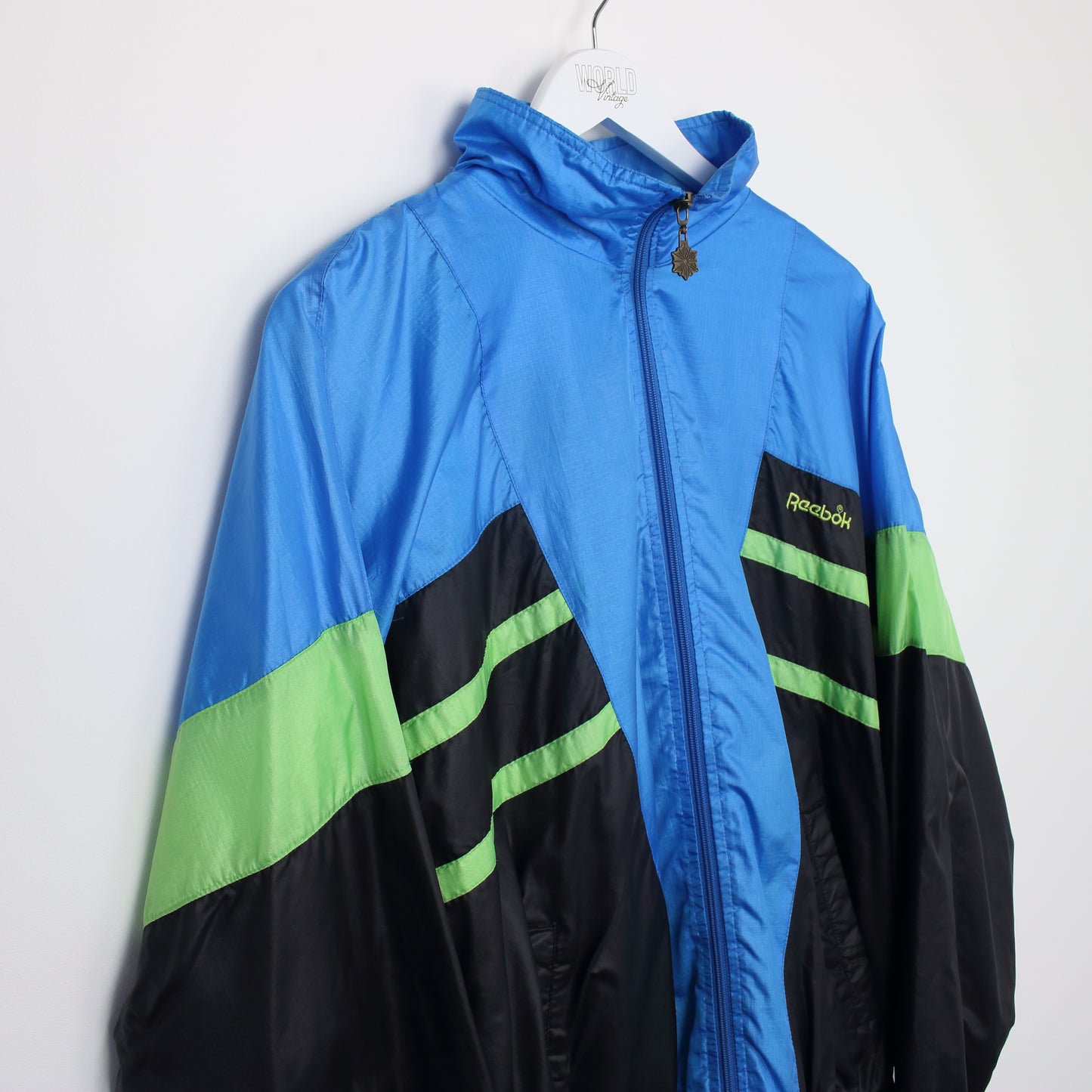 Vintage Reebok track jacket in blue, black and green. Best fits L