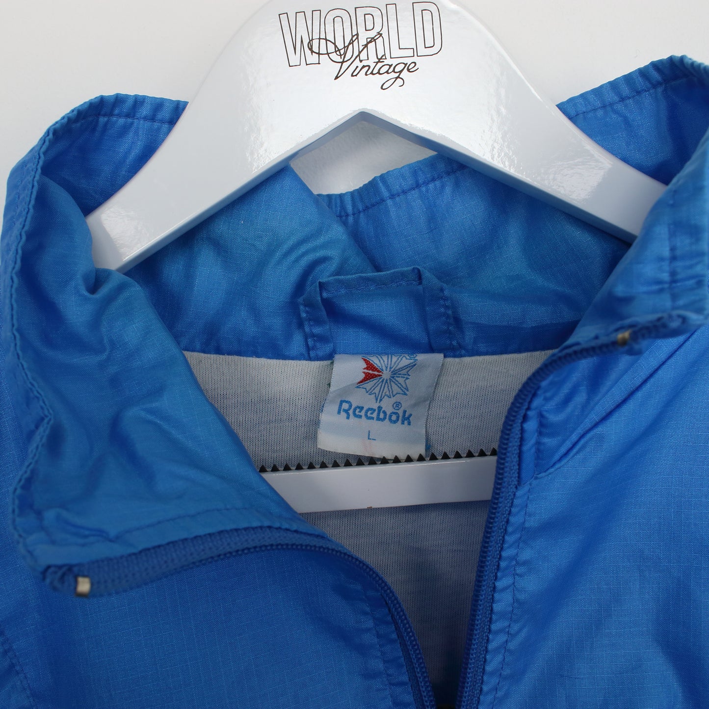 Vintage Reebok track jacket in blue, black and green. Best fits L