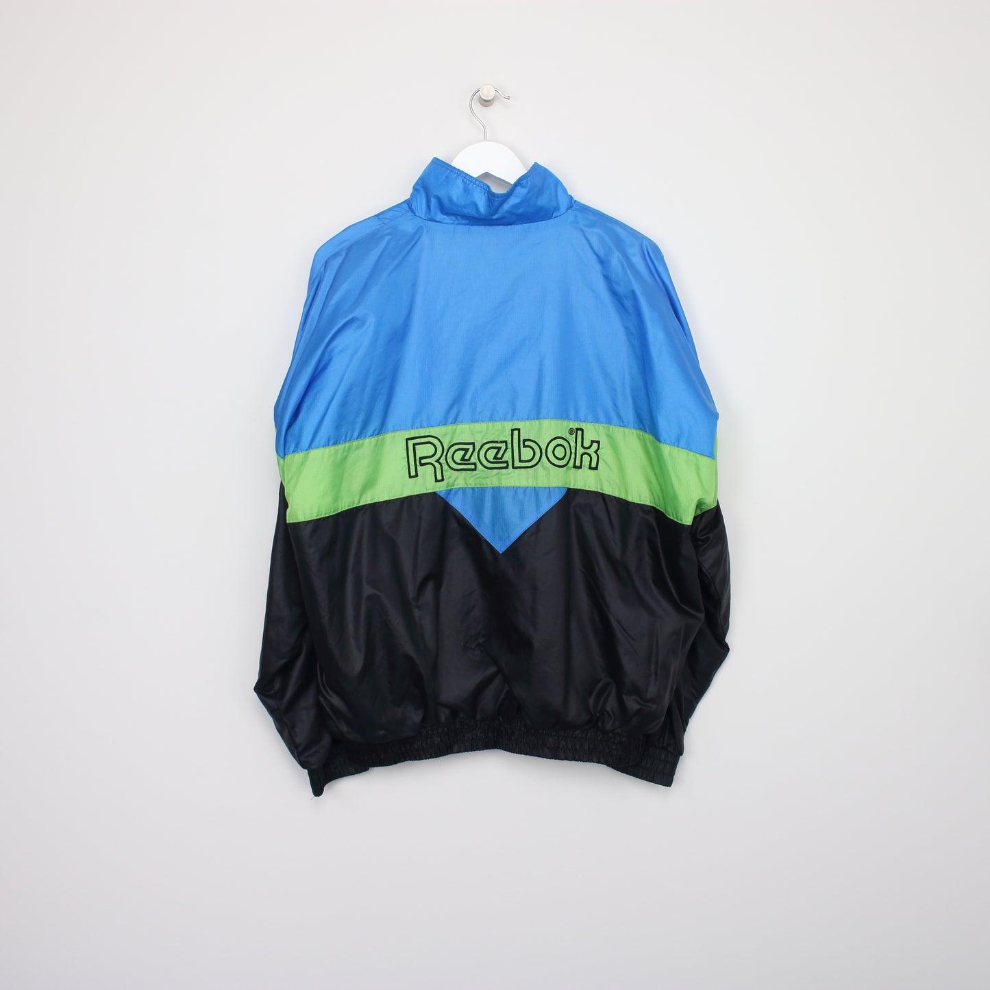 Vintage Reebok track jacket in blue, black and green. Best fits L