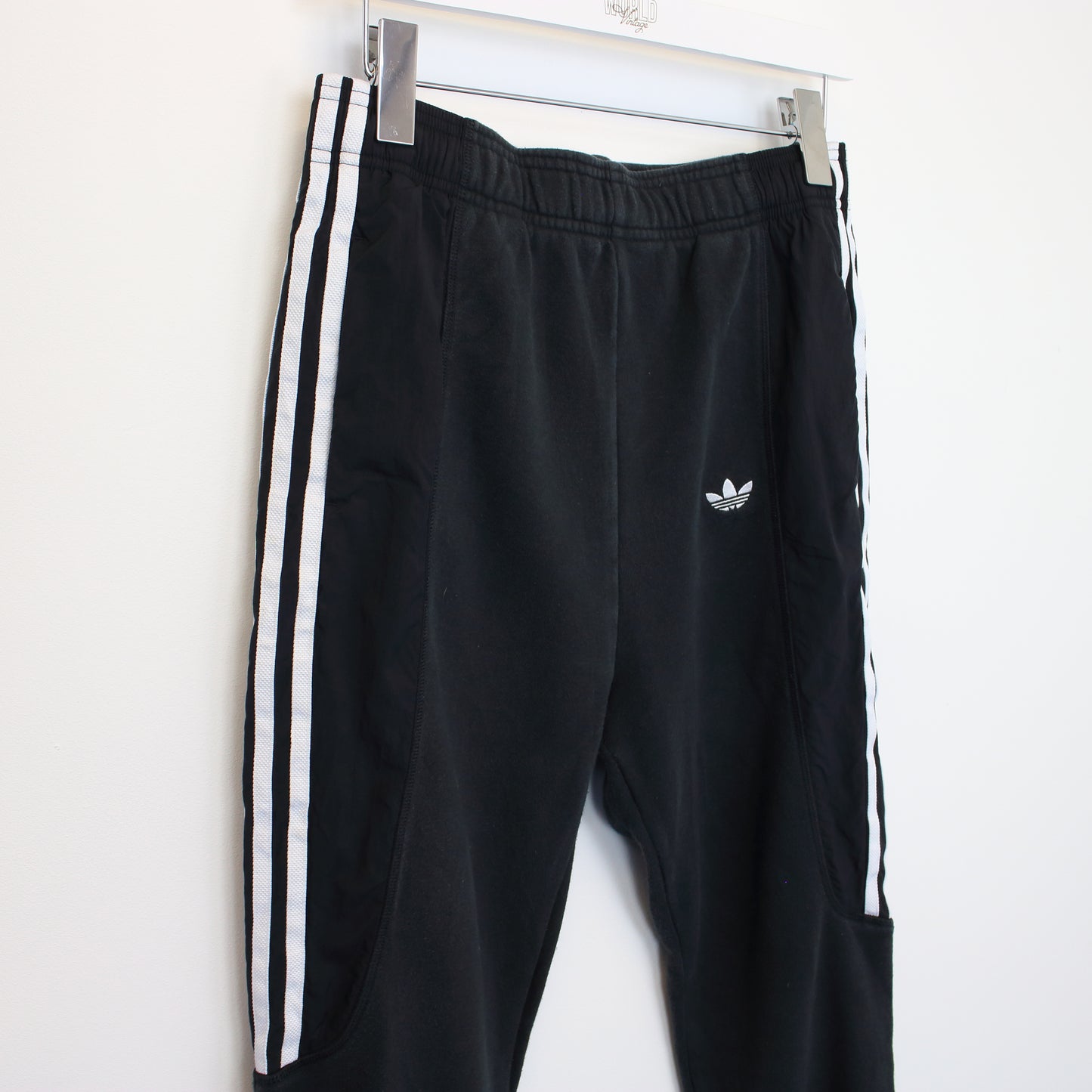 Vintage Adidas joggers in black. Best fits S