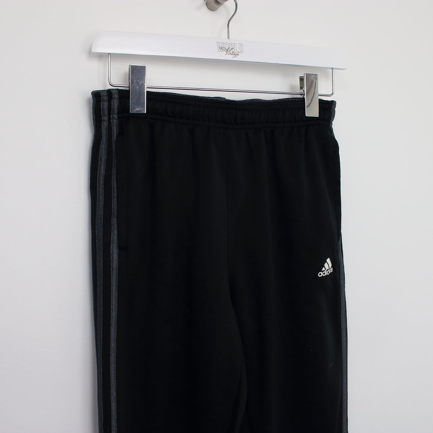 Vintage Adidas joggers in black. Best fits S