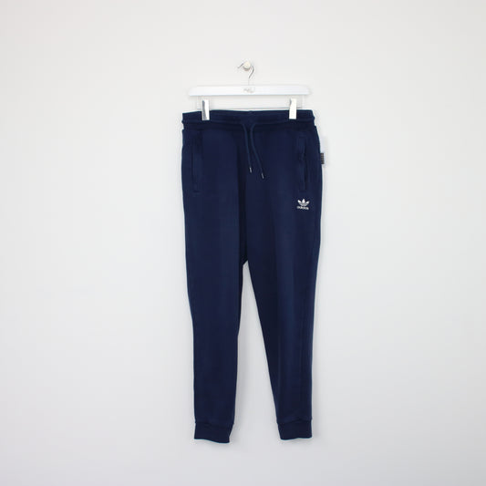 Vintage Adidas joggers in blue. Best fits M