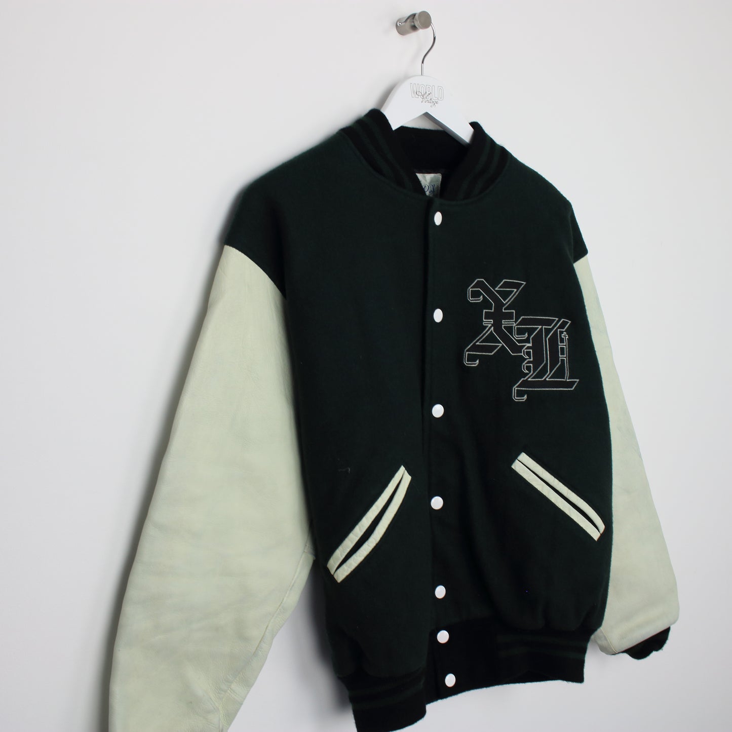 Vintage varsity jacket in green and white. Best fits M