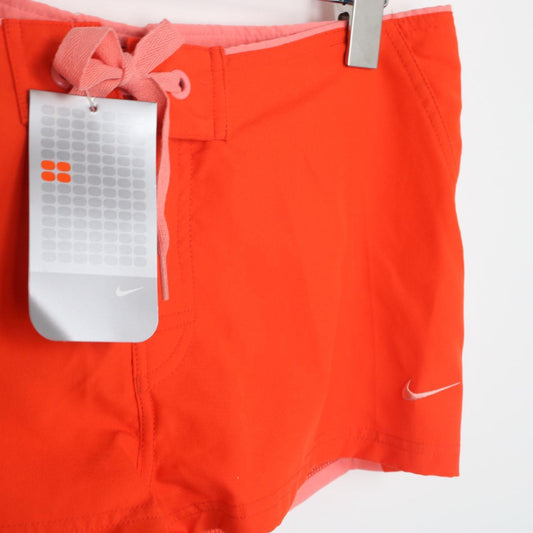 Vintage DEADSTOCK BNWT Y2K Womens Nike swim shorts in orange